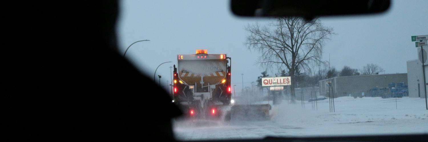  Manitoba driver reviewing insurance discounts paperwork 